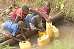 Picture of children in Africa getting water from a river
